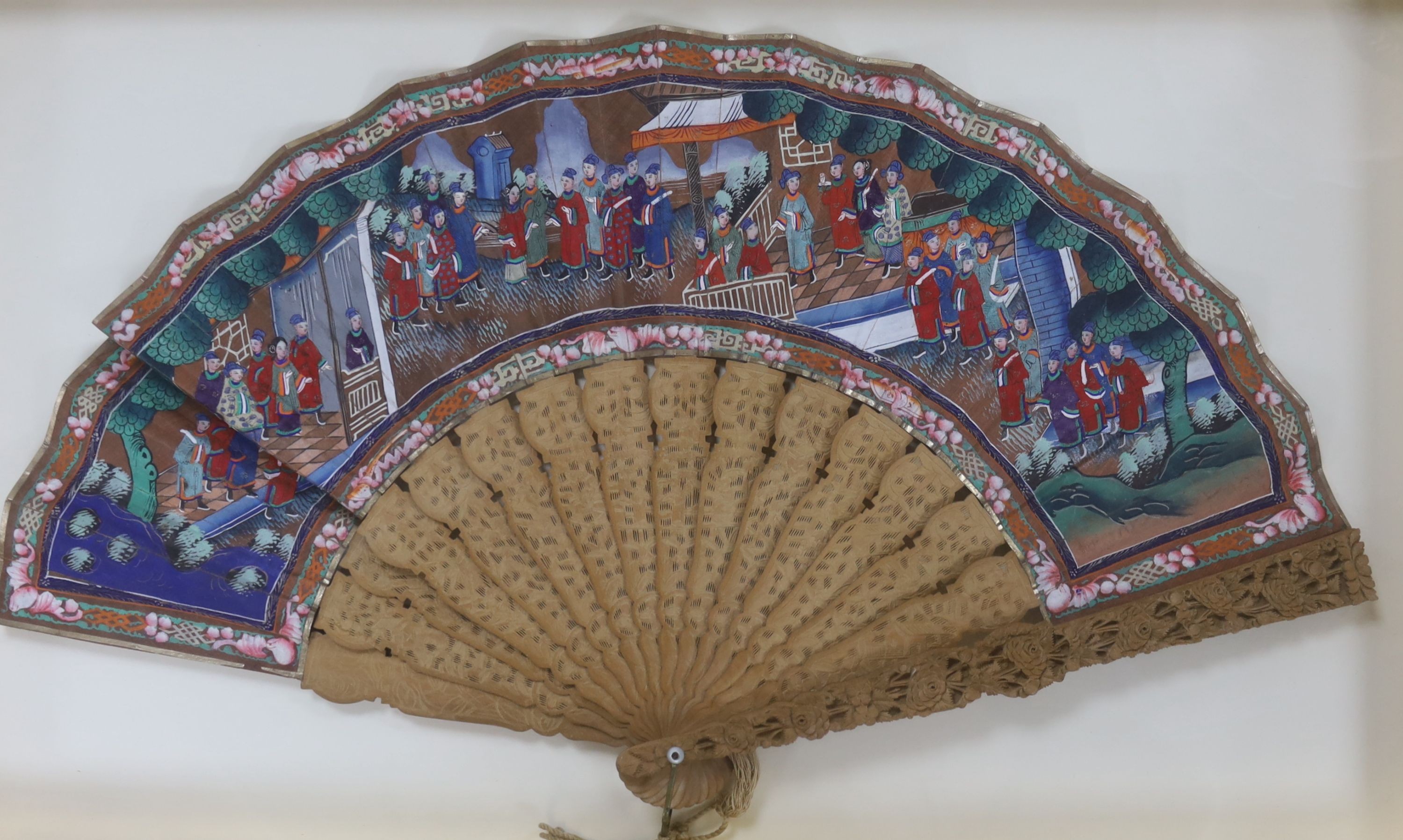 Two Chinese export painted leaf fans, 19th century, one with carved sandalwood guards and sticks, the other with black lacquer, largest case 39 x 63cm